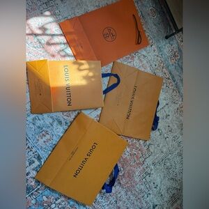 Louie Vuitton and Hermes Shopping Bags